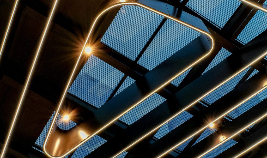 Modern ceiling with geometric lighting and skylights